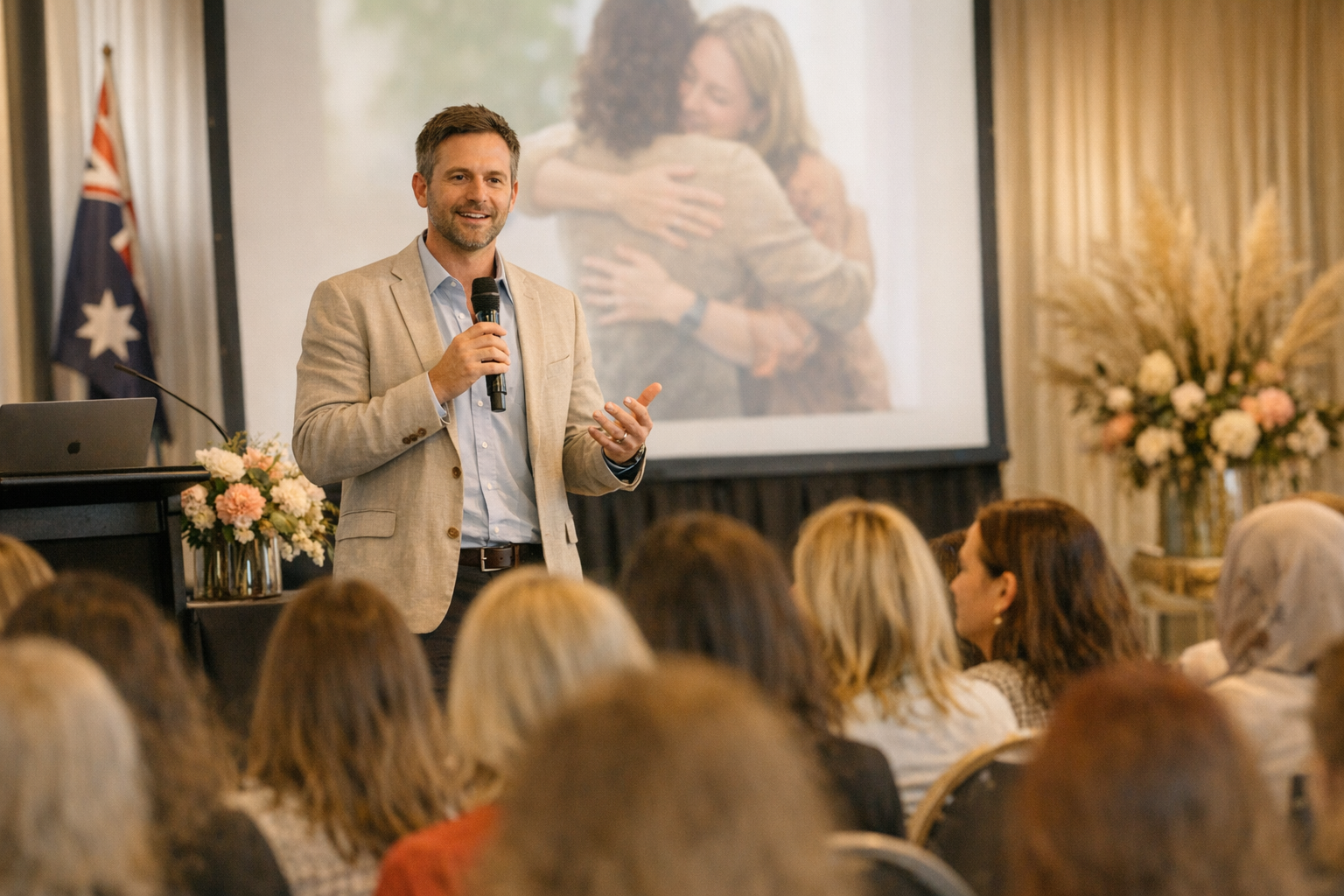 photographic photographic image of a male presenting at a womens mental health conference in Australia no text in image warm light colour-1 photographic photographic image of a male presenting at a womens mental health conference in Australia no text in image warm light colour-1